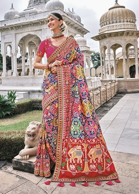 Blue Patola pure silk saree with heavy aanchal Red border and printed blouse (Unstitched)