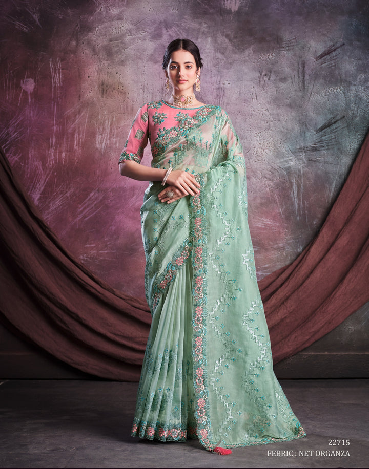 Green pure silk saree with heavy aanchal golden border and baby pink printed blouse (Unstitched)