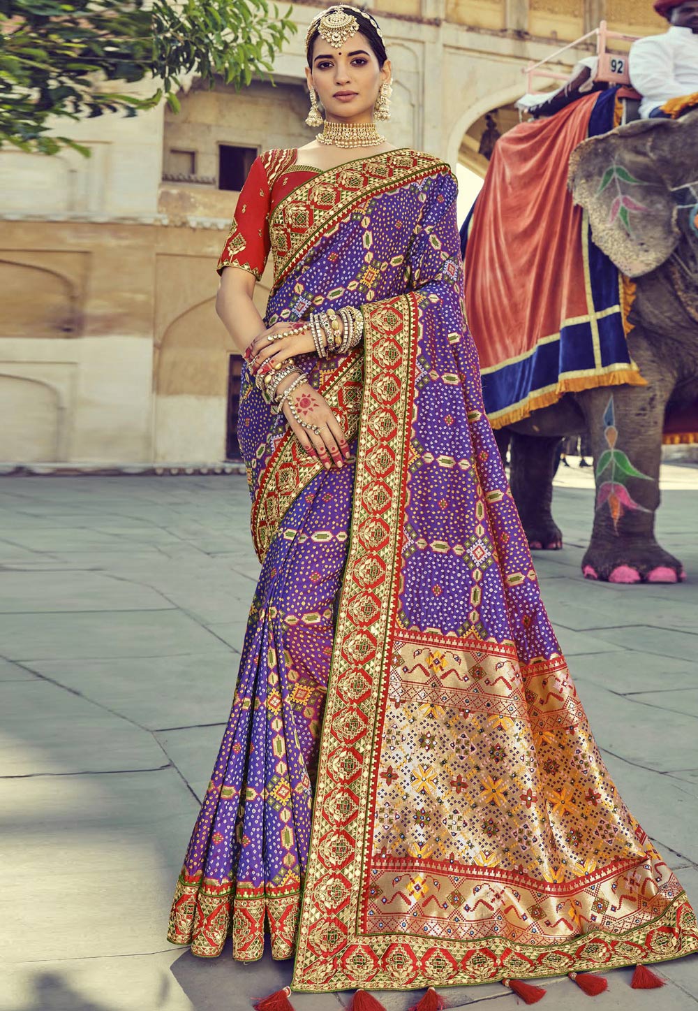 Purple pure silk saree with heavy aanchal golden border and printed blouse (Unstitched)