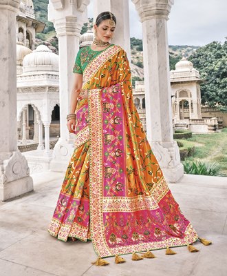 Yellow Patola pure silk saree with heavy aanchal Pink border and printed blouse (Unstitched)