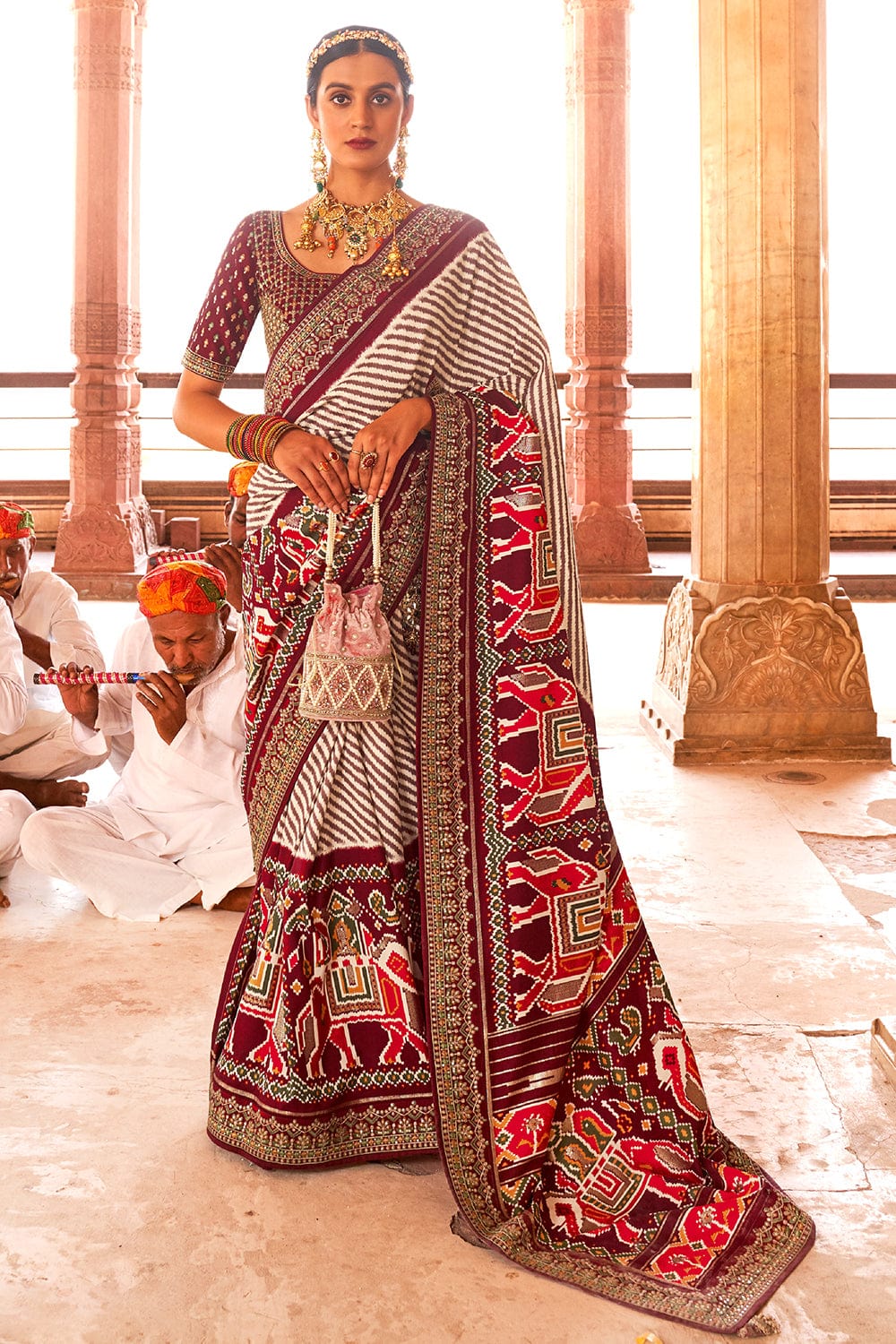 Maroon Patola pure silk saree with heavy aanchal golden border and printed blouse (Unstitched)