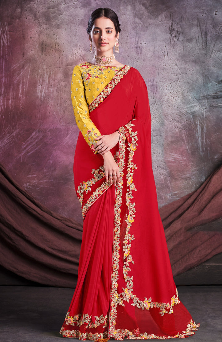 Red pure silk saree with heavy aanchal golden border and yellow printed blouse (Unstitched)