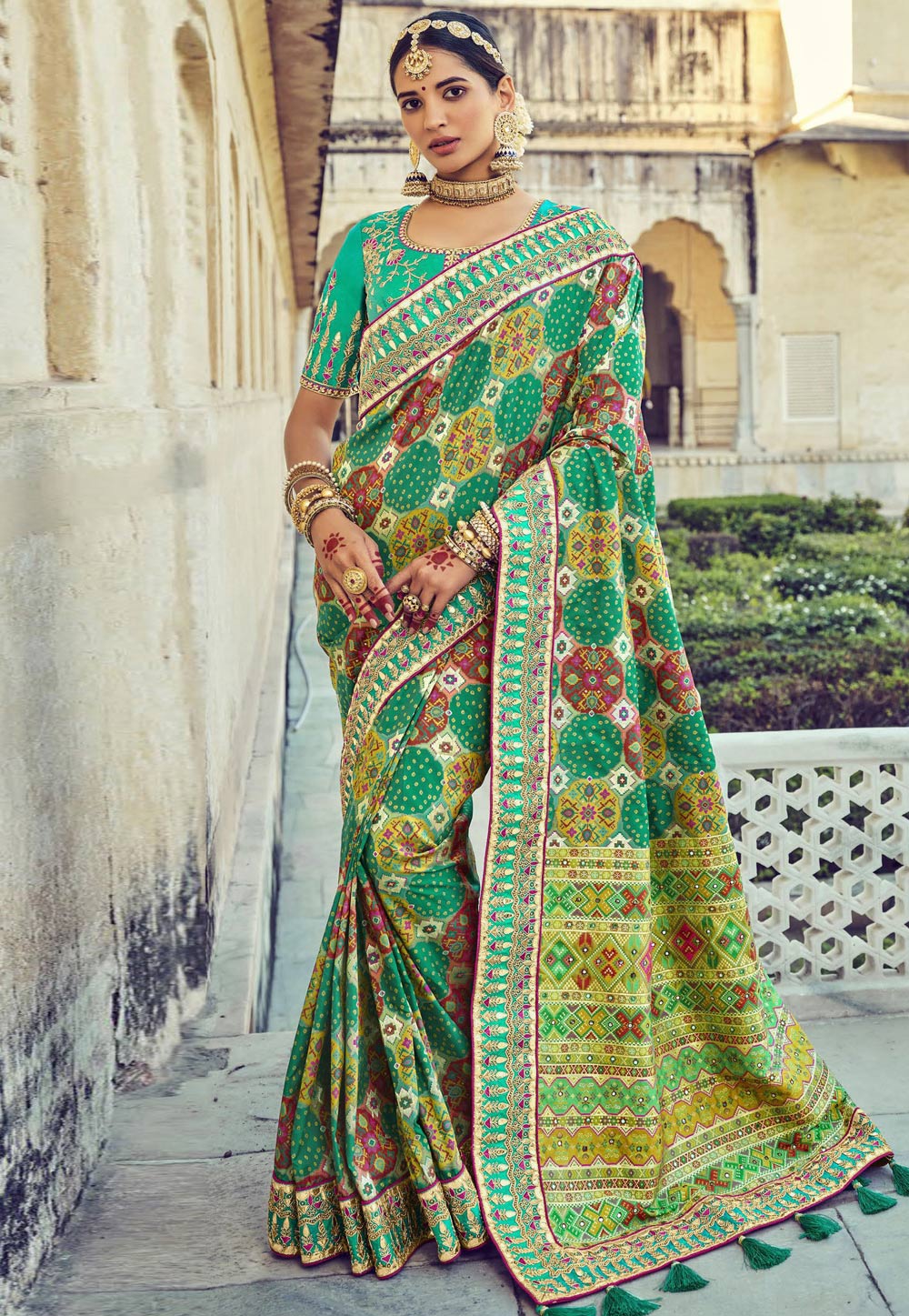 Green pure silk saree with heavy aanchal golden border and printed blouse (Unstitched)