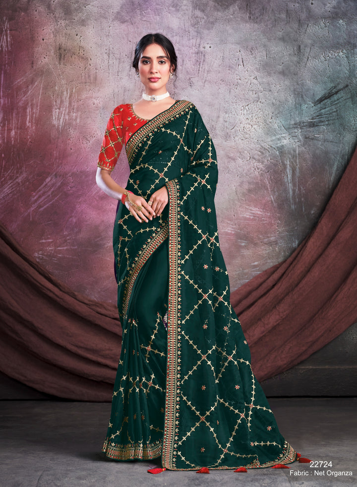 Dark green pure silk saree with heavy aanchal golden border and red printed blouse (Unstitched)