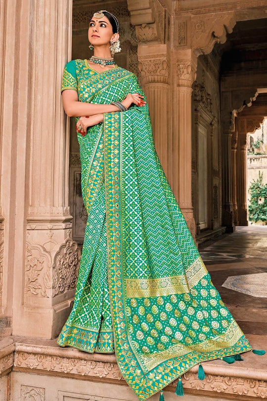 Green Patola pure silk saree with heavy aanchal Golden border and printed blouse (Unstitched)