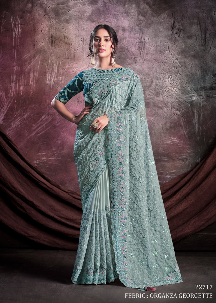 Pastel Blue pure silk saree with heavy aanchal and heavy border and dark sea blue printed blouse (Unstitched)