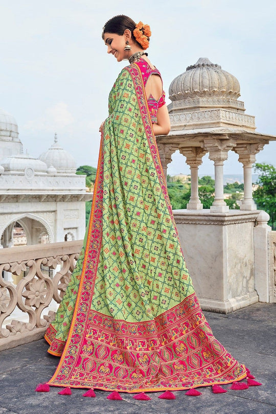 Light Green Banarasi pure silk saree with heavy aanchal pink border and printed blouse (Unstitched)