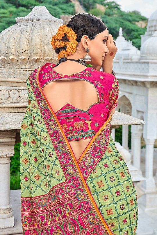 Light Green Banarasi pure silk saree with heavy aanchal pink border and printed blouse (Unstitched)