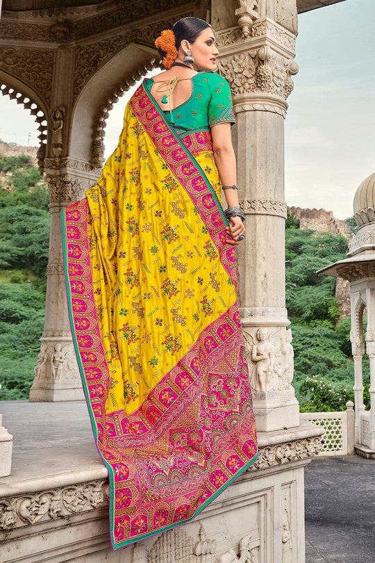 Yellow pure silk saree with heavy aanchal pink golden border and green printed blouse (Unstitched)