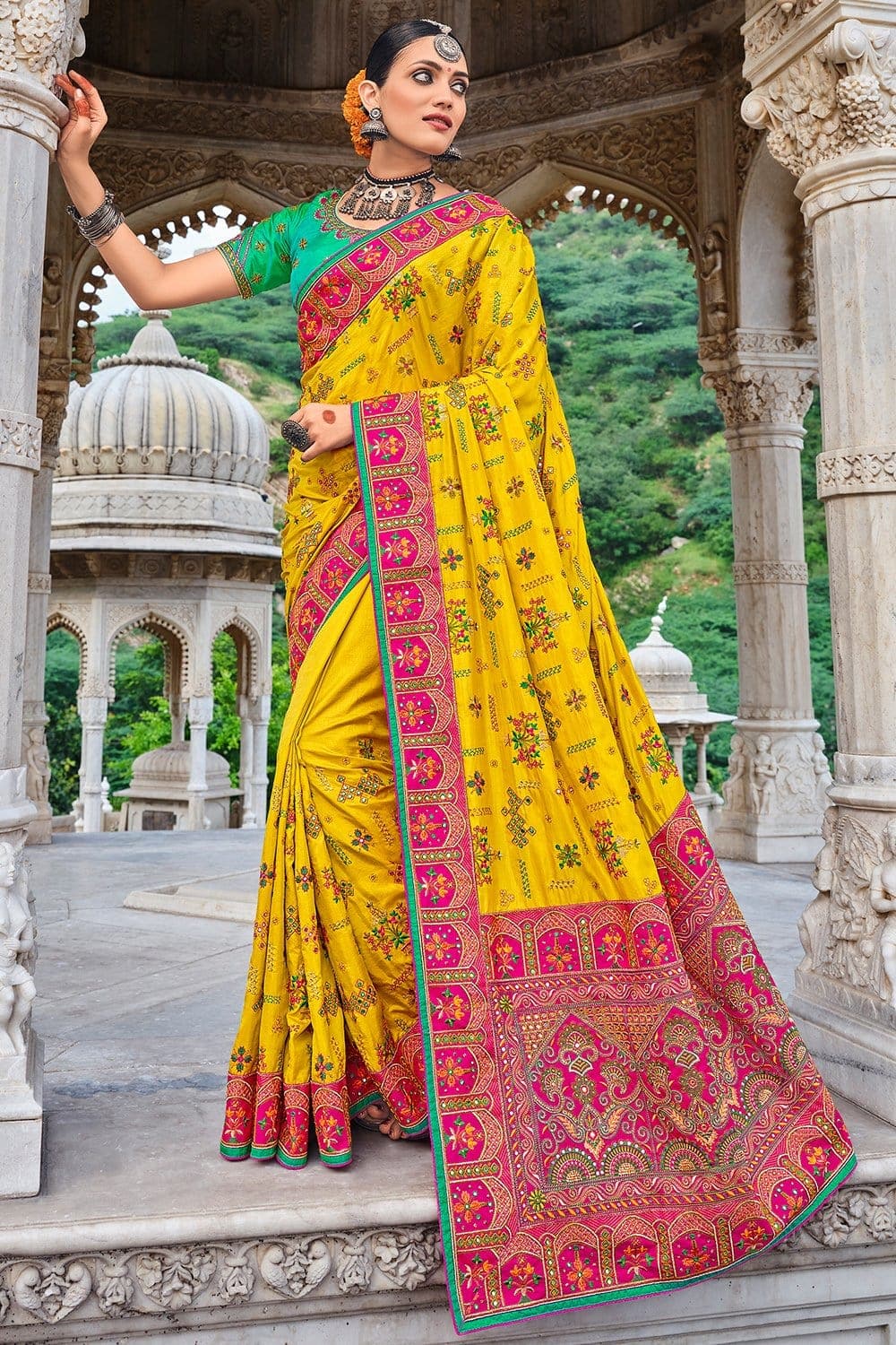 Yellow pure silk saree with heavy aanchal pink golden border and green printed blouse (Unstitched)