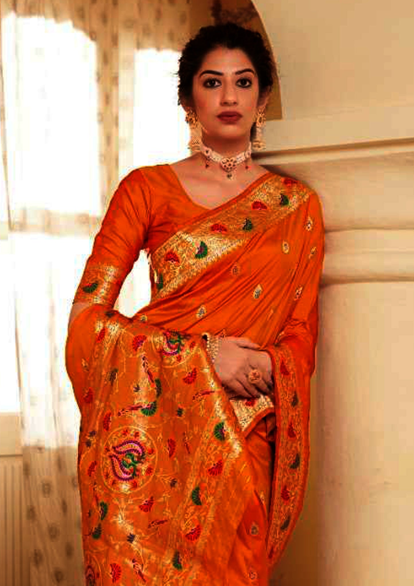 Orange pure silk saree with golden border and matching blouse (unstitched)