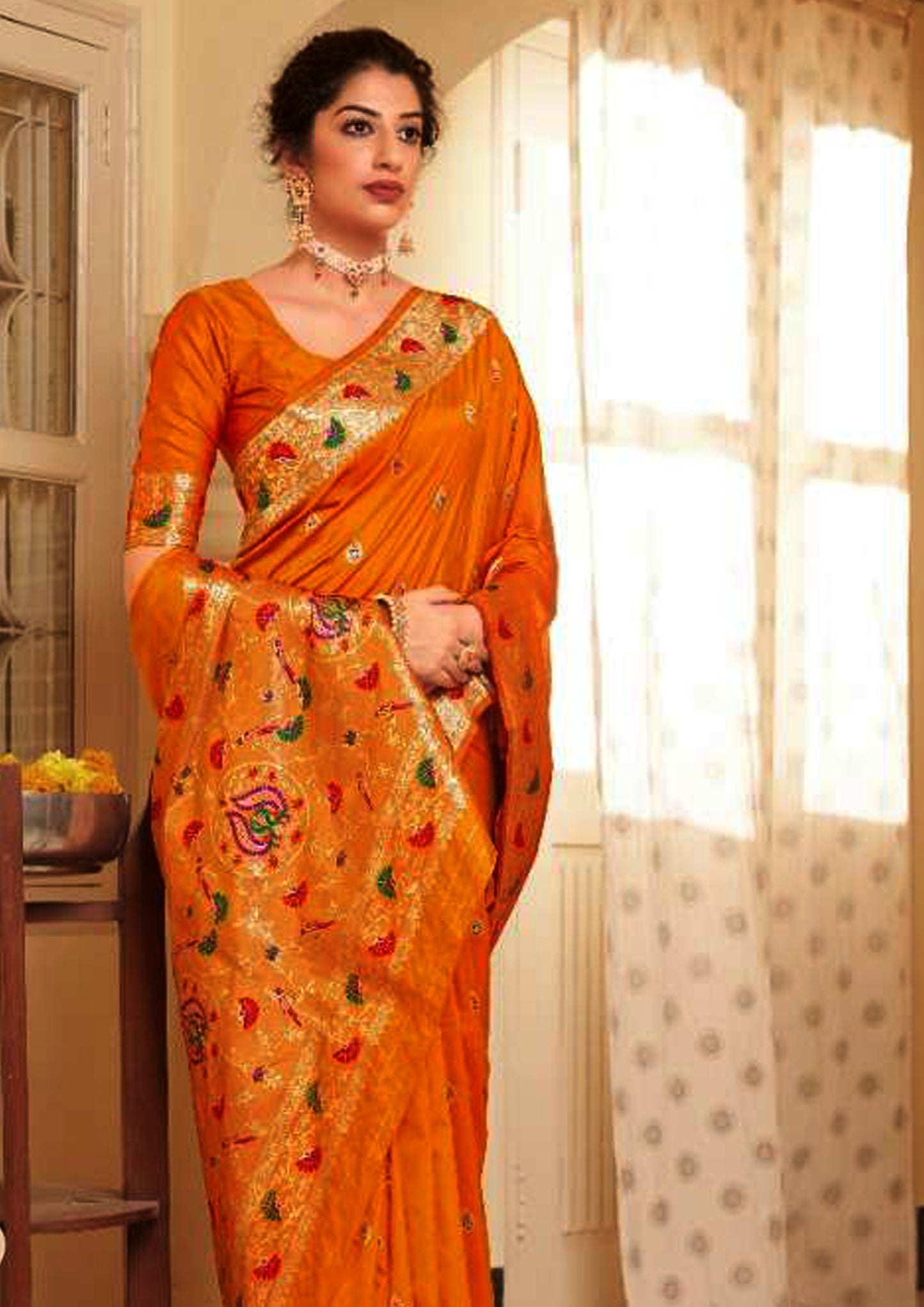 Orange pure silk saree with golden border and matching blouse (unstitched)